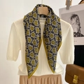 Elegant black and olive paisley square scarf on hanger with a casual outfit - Green