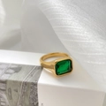 Macro shot of 18K gold ring featuring a rectangular emerald-cut green zircon stone - US 6 / Wide Smooth Style (Large Green)