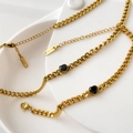 Detailed macro view of K18 gold necklace chain with faceted black heart charms - Black Heart Pendant Necklace