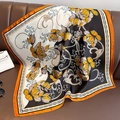 Detail of silk satin square scarf with yellow floral prints on a leather sofa - Large Square / Black Coffee