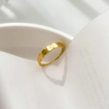 Detailed view of gold scalloped ring casting a romantic heart-shaped shadow on white background - Glossy Multi-Circle