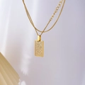 Close-up of golden rectangular checkerboard pendant with pave-set zircon stones - Full Zirconia Square Plate / Gold