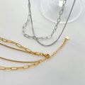 Dettaglio di catene multistrato oro e argento con ciondolo a cuore e chiusura a moschettone - Catena a Maglie Vuote a Doppio Strato (Oro)