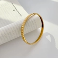 Macro detail of 18K gold-plated titanium steel bracelet with geometric gear-like texture - Wide Gear Gold (Inner Diameter 5*6cm)