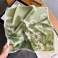 Fashionable green silk daisy print square scarf held against a premium lifestyle background - 53x53cm / Green