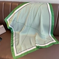 Elegant green and white striped silk square scarf on a leather surface with accessories - 70x70cm / Green