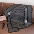 Polka dot silk scarf with camellia flower accents displayed on a leather handbag - Black Polka Dot Camellia (W-85-1-Black)
