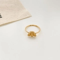 Macro view of 18K gold plated ring featuring a detailed small honeybee design on a slim band - US 6 / Bee