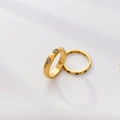 Detailed view of gold rings with marquise zircons and black pavé stone accents - US 6 / White Zircon Evil Eye