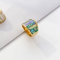 Macro detail of wide gold ring featuring iridescent abalone shell inlay and stripes - US 6 / Abalone Shell