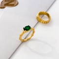 Detail of bamboo texture gold ring with oval green zircon and wave pattern shell ring - US 6 / Bamboo Green Zircon