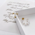Detailed close-up of C-shaped pearl drop earrings featuring multiple white pearls on gold posts - White Pearl C-Shaped Style