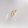 Detailed view of the gold-finish open ring featuring abstract olive leaf motifs - Leaf / US 6