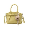 Fashionable yellow bucket handbag in lychee texture leather with a cute brown bear charm - Yellow