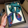 Dark green silk square scarf with colorful feather patterns draped on a white magazine - 70*70cm / Blue Border (W-303)