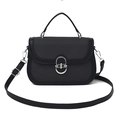 Classic black saddle handbag featuring textured fabric and silver metallic buckle - Black