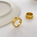 Detail of 18K gold-plated double-layer geometric ring with polished finish and ribbed texture - US 6 / Double Arc Surface