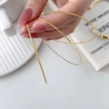 Set van drie dunne gouden armbanden met gedraaide, gepolijste en gefacetteerde texturen - Gedraaide Draad Stijl / 6CM Doorsnede