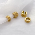Detail of 18K gold-plated titanium steel ribbed ear cuffs on white mesh fabric - Threaded Ear Buckle Gold (Width 0.6cm Diameter 1.3cm)