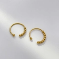 Detail of 18K gold-plated C-shape hoop earrings with polished and frosted beads - 5-Bead Open (Left)