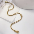 Detail of gold double-layered snake chain with knot design and K18 hallmark tag - Knotted Snake Bone Chain Style