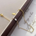 Detail of gold snake chain bracelet with freshwater pearls and a heart pendant - Irregular Freshwater Pearl Style