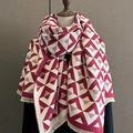 Close-up of red and beige V-shaped geometric pattern cashmere-like scarf with fringe - Red