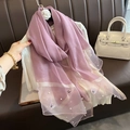 Detail of purple faux silk scarf with butterfly embroidery and delicate pearl accents - Light Purple
