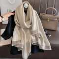 Elegant champagne silk shawl with shiny silver metallic borders for high-end fashion styling - Beige