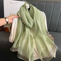Detail of light green silk scarf with metallic stripes and mauve hem finish - Fruit Green