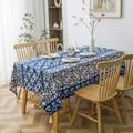 Blue and white vintage pattern linen tablecloth with decorative white tassels on wooden table - Blue and White Porcelain