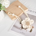 Detail of woven floral curtain tieback with jute rope and large decorative pearls - Beige Flower With Pearl