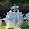 Light blue floral tablecloth with pink flowers and berries featuring a ruffled edge - Sky Blue Plum