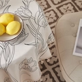 Detail of white linen tablecloth featuring black tulip sketches and handcrafted tassels - 60*60cm / Tulip