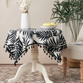 Round beige cotton linen tablecloth with black tropical leaf pattern and fringe tassels - Black Leaf