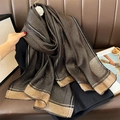 Elegant black silk scarf with gold lurex stripes and metallic gold trim for women - Black