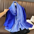 Detail view of gradient blue satin scarf with floral ornament on a leather background - 90*180cm / Light Blue-Dark Blue Gradient