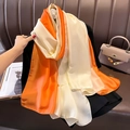 Detail of elegant gradient orange and beige satin silk scarf with a smooth lustrous finish - 90*180cm / Beige-Orange Gradient