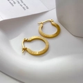Detailed close-up of 18K gold plated hoop earrings with vertical ribbed texture and plug-in clasp - Ribbed Texture Style