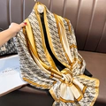 Elegant gold chain monogram silk scarf draped over a classic leather sofa in a luxury setting - 90*180cm / Beige