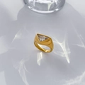 Macro shot of a wide 18K gold-plated band featuring a triangular zircon in bezel setting - Triangle Zirconia