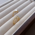 Close-up of 18K gold plated titanium ring with marquise-cut and small round zirconias - US 6 / Double Layer Round Zircon