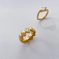 Detail of 18K gold-plated rings featuring teardrop cubic zirconia and beaded band design - US 6 / Linked Waterdrop One Zircon