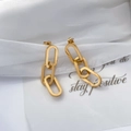 Detail of gold chain drop earrings with three textured oval links and matte finish - Chain Hollow