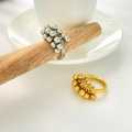 Detail of 18K gold and silver titanium steel rings with clustered metal bead waves - US 6 / Small Bead Grape Cluster Style / Gold