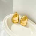 Detailed view of wide curved square stud earrings in 18K gold plated titanium steel - Rectangular Arc Smooth