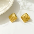 Macro shot of 18K gold plated rhombic stud earrings with vertical striped texture details - Square Rhombus Stripe