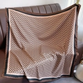 Detailed view of the luxury silk scarf showing vintage chain print on soft satin fabric - Coffee Edge