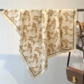 Detail of silk-like twill scarf with letter patterns hanging on a metal rack - 90*90cm / Beige