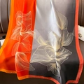 Floral silk scarf with orange and grey color blocks draped on a luxury leather sofa - 90*180cm / Orange Black